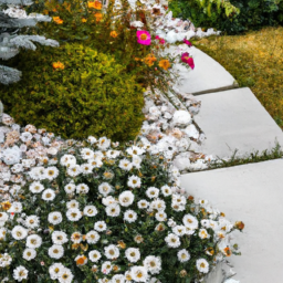 description: a photo of a backyard with a white landscaping rock border, a pathway made of white rock and pavers, and a flower bed with green foliage and colorful blooms. the overall look is modern and minimalist.